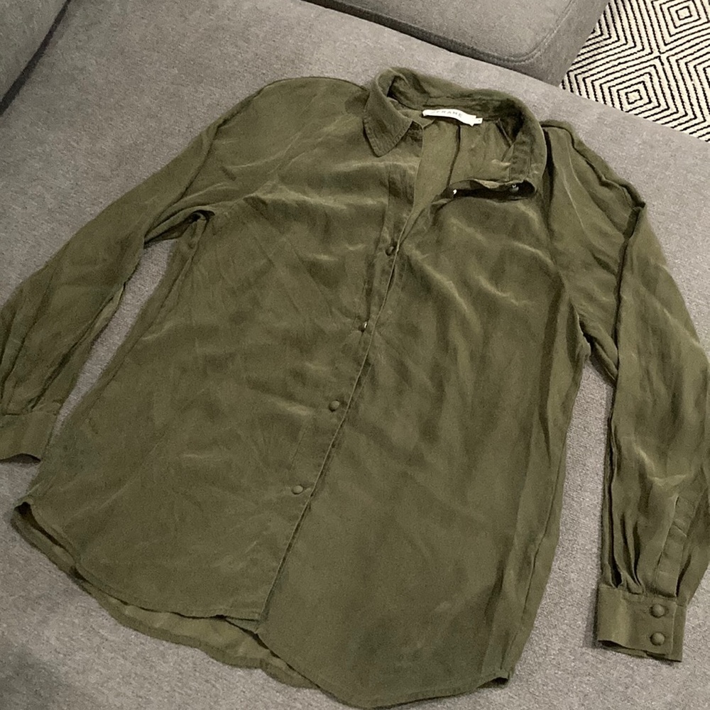 100% silk army green button up blouse with cut out sleeves.